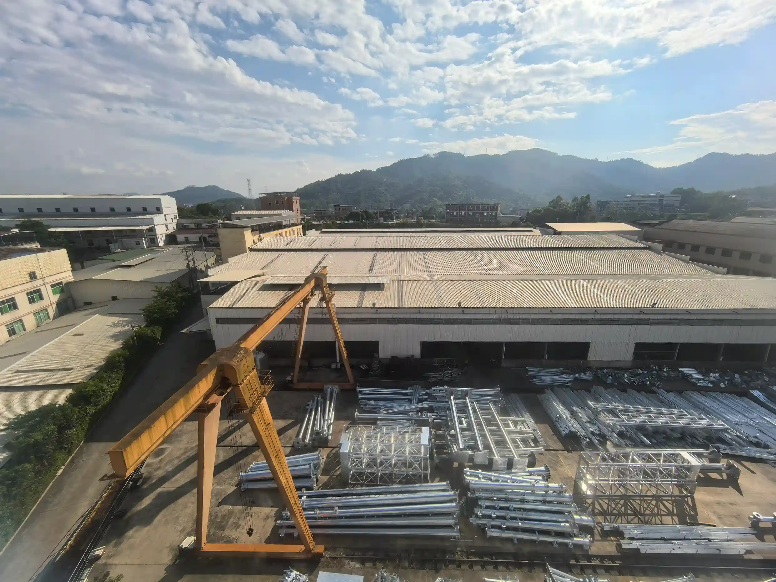 Steel tower factory with cranes under blue sky​