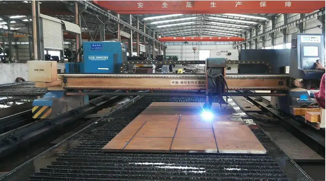 ​​CNC plasma cutting metal sheet with sparks in factory​