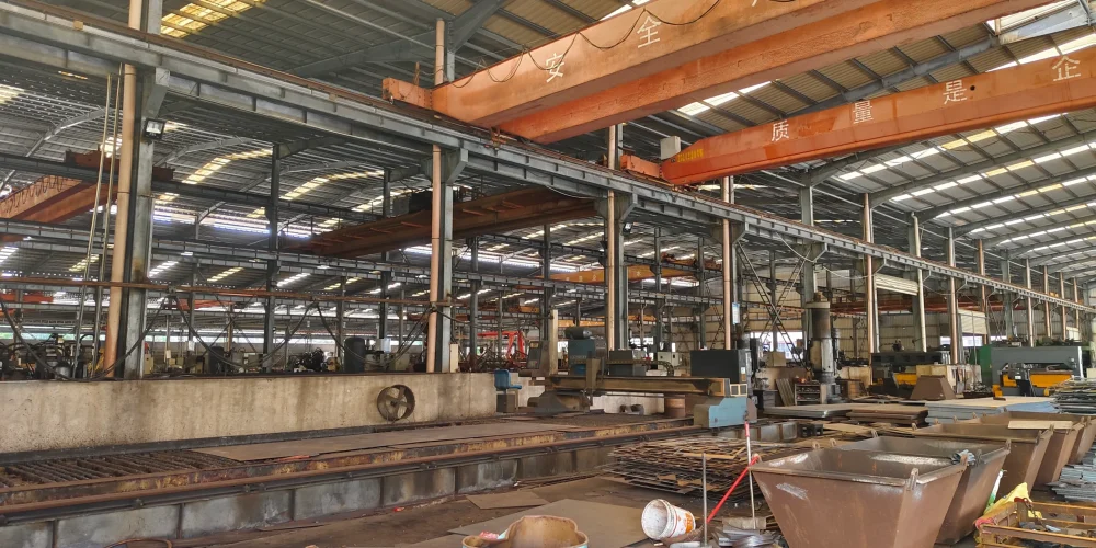 ​​Factory interior with safety slogans and structural steel framework​